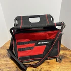 Snap-on Bag With Integrated Folding Seat Stool Red Black Shoulder Strap Used. Price: $149.99.